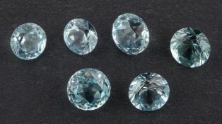 ! Six round, mixed-cut aquamarines