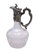 A Continental silver mounted cut glass claret jug,