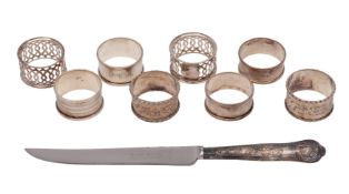 A collection of eight silver napkin rings,