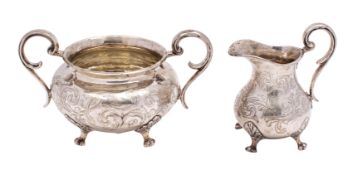 A Victorian silver circular twin-handled sugar basin and matching pear-shaped cream jug,