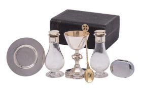 A late Victorian silver matched travelling communion set, comprising a cup and paten,