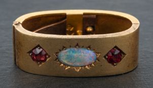 An early 20th century, red paste and opal doublet, hinged tie clip, stamped '15CT', total length ca.