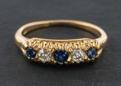 A round, mixed-cut, possibly synthetic sapphire and old-cut diamond, five-stone ring,