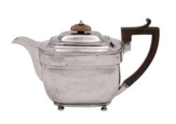 A George III silver teapot, maker John Emes, London 1806 of barge-shaped outline,