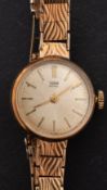 Tudor, a gold dress watch the silvered dial with raised baton numerals,