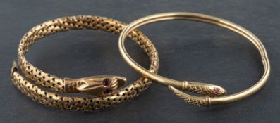 Two serpent bangles, including a 9ct gold bangle with ruby eyes,