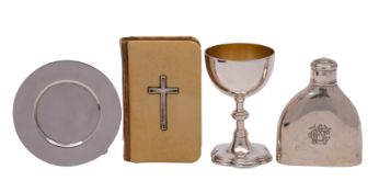A silver travelling communion set comprising: a Gothic style chalice, with petal base,