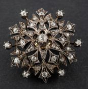 A late 19th/ early 20th century, rose, single and old-cut diamond, openwork brooch/ pendant,