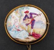 A brooch depicting a courting couple in a landscape the manner of Fragonard,
