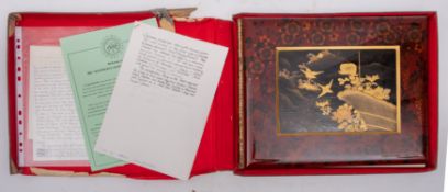 JAPANESE LAQUERED ALBUM : A highly ornate album containing thirty-four photographs several hand