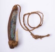 A Maori Pa Kahawai (trolling lure) fish hook: the wooden shank with Matau Paua shell and bone hook