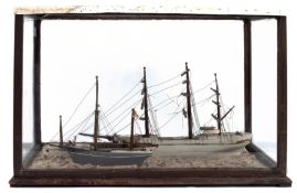 A late 19th century cased diorama of sailing vessels: comprising a white hulled three masted ship,