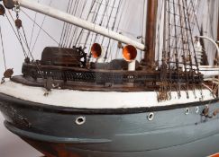 A cased scale model of the sailing ship 'Cicely': standing and running rigged over planked deck