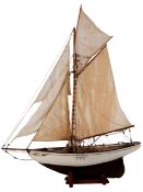 Scale model of a gaff rigged sloop: set full sails over pine deck with fixtures and fittings,