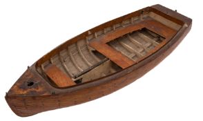 An early 20th century apprentice model of a clinker built dinghy: plank and pinned hull with