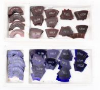 A collection of early 20th century engine telegraph blue and red glass overlaid indicator sections: