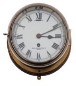 A Smiths bulkhead clock: white enamel dial with Roman numerals signed 'Smiths English Clock Ltd,