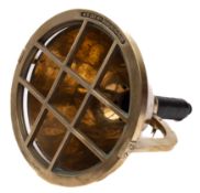 A brass diver's light: the 12 inch housing with guard stamped 'NS cat No.