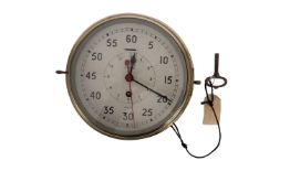 A Smith 'Astral' brass bulkhead clock: white enamel dial signed as per title with Arabic minutes