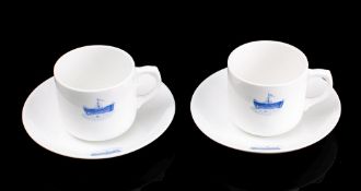 A pair of Royal Navy Hospital HMS Dreadnought coffee cups and saucers by Adderley: with blue glaze