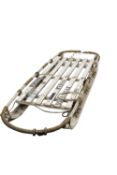 A 20th century Nansen pattern Expedition sledge: cord bound white over painted beech,