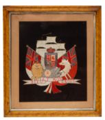 An early 20th century silkwork Royal Coat of Arms: central shield with crown flanked by lion and