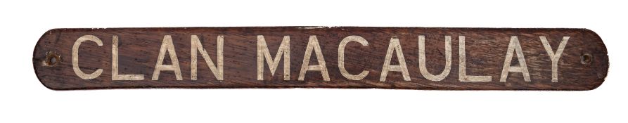 A lifeboat name board for the Clan Line Steamer 'Clan Macaulay': white text on a teak plinth 56 x
