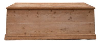 A large pine trunk: fitted iron drop handles to either side, 56 x 159 x 68cm.