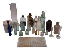 A Pharmacy display decanter and stopper of baluster form : filled with a red coloured liquid,