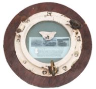 A battle damaged port hole from the Royal Navy Black Swan-class sloop HMS 'Amethyst' (U16): the