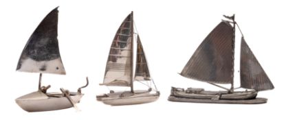A small silver model of a catamaran: 9.