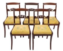 A set of five Regency mahogany side chairs,
