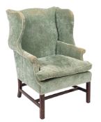A mahogany wing frame armchair in the George III taste,