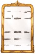 A French giltwood and composition framed overmantel mirror in Louis XV taste,