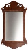 A walnut fret framed wall mirror in George I style,