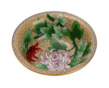 A Chinese cloisonne bowl decorated with colourful flowering stems on a pale yellow ground,