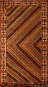 A Turkomav rug, the serated chevron design field enclosed by a hooked cruciform border,