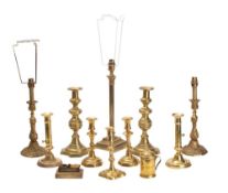 A collection of mixed brass domestic wares includes;- table lamps, candlesticks,