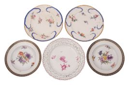 A group of five Continental porcelain plates including a Berlin puce monochrome decorated plate