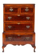 A walnut and crossbanded chest on stand in the early 18th Century manner,