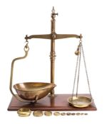 A set of late Victorian brass and mahogany mounted balance scales,
