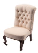 A Victorian carved rosewood nursing chair with upholstered button down back and bowed stuff over