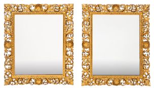 A pair of 19th Century carved giltwood Florentine wall mirrors of rectangular shape,