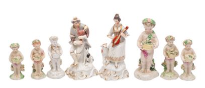 A pair of Staffordshire porcelain figures of musicians and six late 18th century Derby figures of