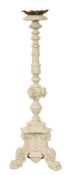 A carved and painted oak torchere stand in Baroque taste,