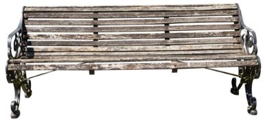 A pair of painted wrought iron and wood garden benches,