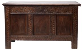 A 17th century carved oak coffer,