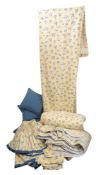 A pair of blue floral spray decorated interlined curtains to a yellow ground,