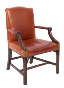 A mahogany library armchair of Gainsborough type with upholstered stuff over back,