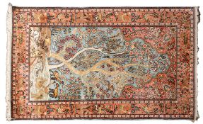 A Kashmir silk prayer rug, the pastel blue mihrab with a tree of life design,